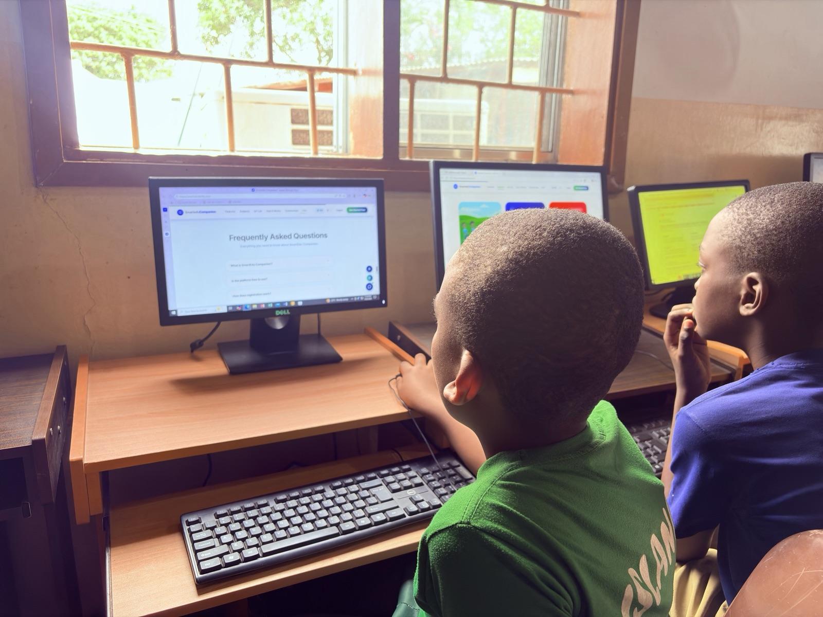 Pupils reading SmartEdu lessons on the lab computers