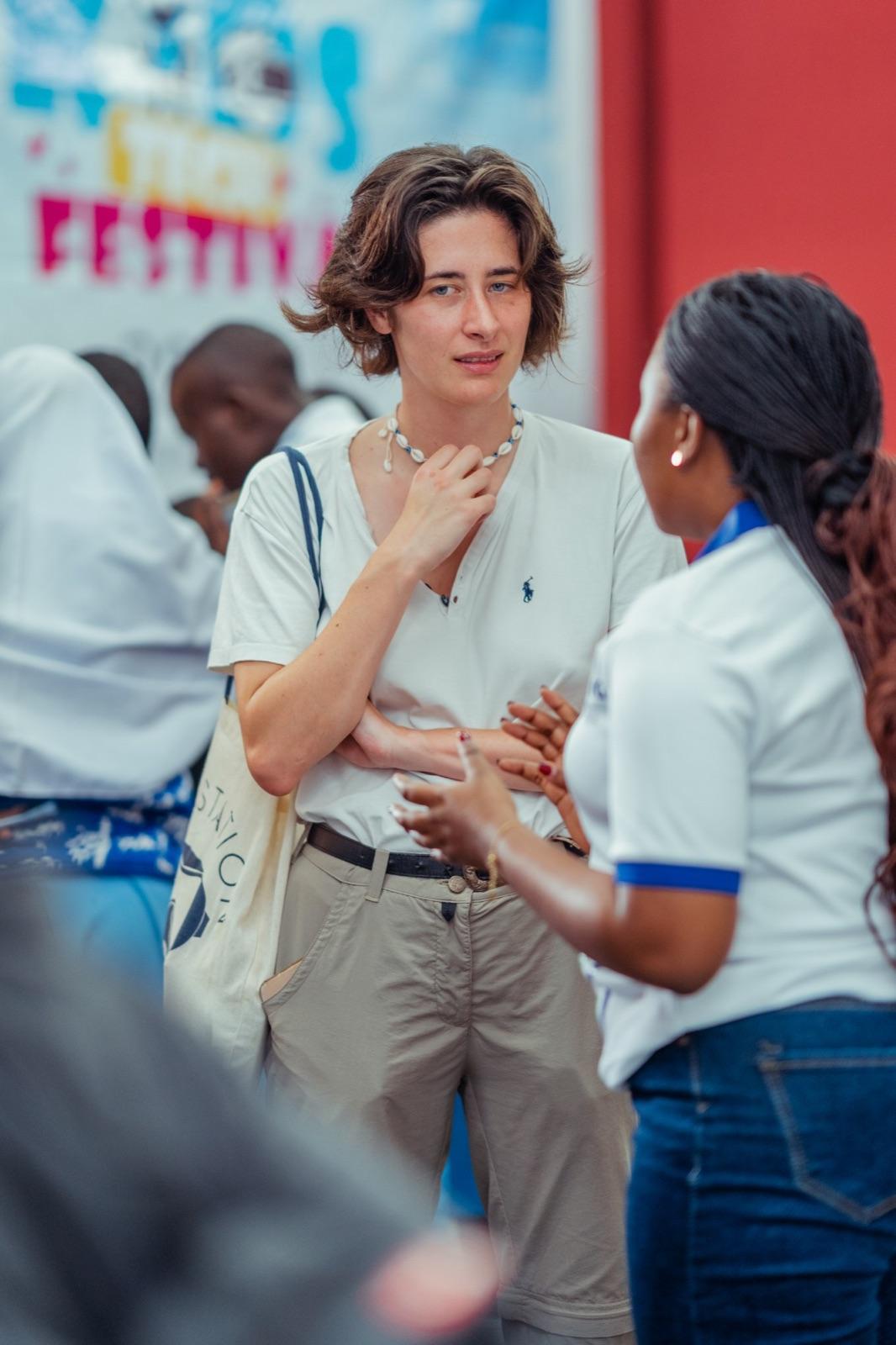 A TECH IQ team member talking with a visitor